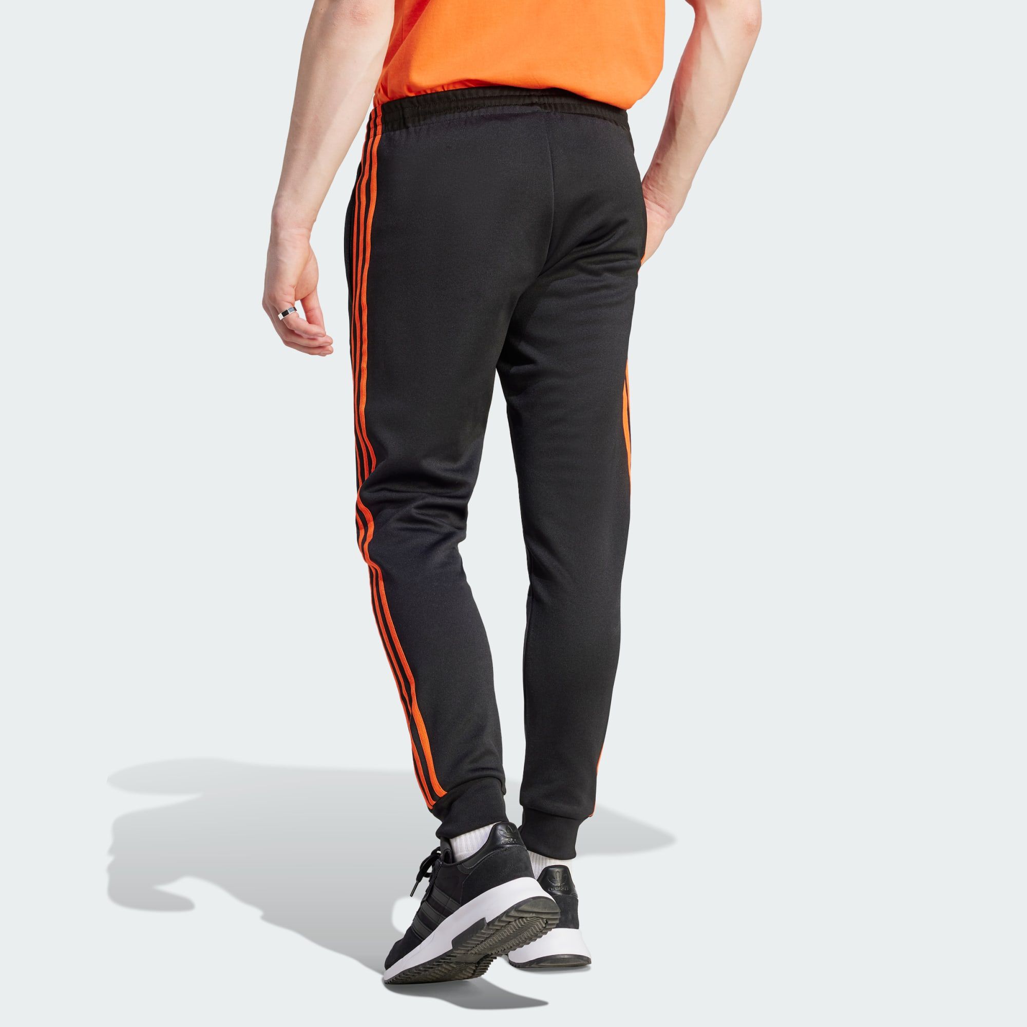 Adidas originals best sale track pants orange