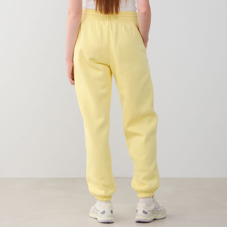 NIKE PANT JOGGER PHOENIX OS GEEL/WIT DAMES